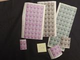 a table topped with lots of different stamps on top of a black table
