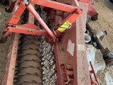 an image of a tractor with a plow attached to it