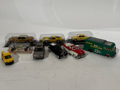 a lot of toy cars that are sitting on a table