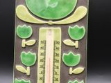 a thermometer with a picture of a frog on it