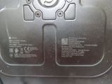 a close up of a metal object with a button on it