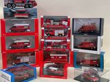 many different models of fire trucks in a display case
