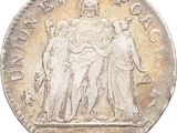 a silver coin with an image of three women and a man