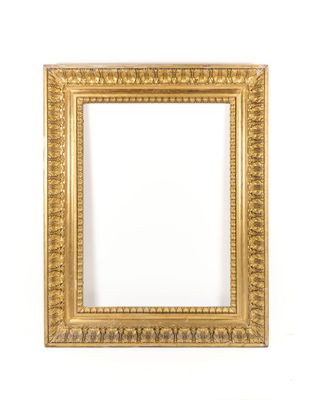an antique gold frame with a decorative pattern on a white background