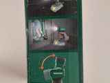 a box with a picture of a green machine inside of it