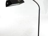 a close up of a desk lamp on a desk with a white background