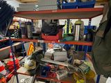 a garage with a lot of tools on the shelves