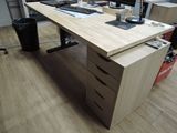 a desk with a computer monitor and a keyboard on it