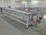 an image of a factory with a conveyor belt in the middle of it