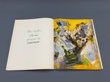 an open book with a picture of a tree on it