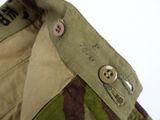 a close up of a military uniform with buttons on it
