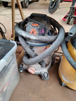 an image of a vacuum and other tools in a garage
