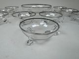 a lot of glass bowls that are sitting on a table