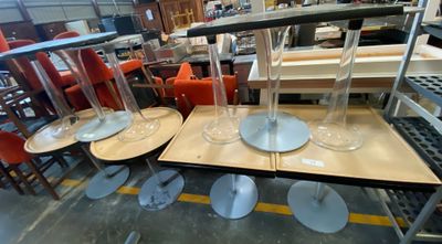 several empty wine glasses are sitting on a table in a store