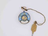 a small clock and a key attached to a chain
