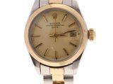 an image of a gold and silver wrist watch with roman numerals
