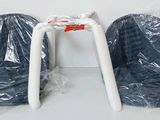 two chairs that are wrapped in plastic on the floor