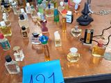 a table with a lot of perfume bottles on it