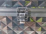 a close up of a metal box with a latch