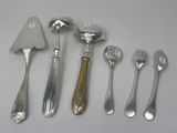five different types of silverware on the table