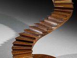 an image of a wooden sculpture of a spiral staircase on top of a wooden base