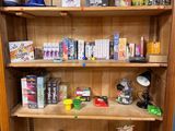 a wooden cabinet with many items on top of it