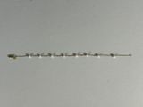 a close up of a metal chain with beads on it