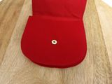 a red hat sitting on top of a wooden table