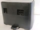 an image of a black portable projector sitting on top of a white table