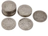 several coins are stacked on top of each other on a white surface