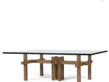 the table is made of wood and has a glass top