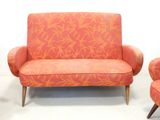 two chairs and a couch in a room