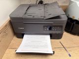 a printer that is sitting on top of a desk