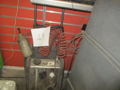 a picture of an old type of air conditioner in a garage