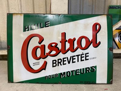 a sign that says castrool on the side of a building