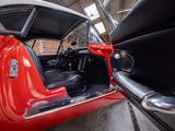 an image of a red car parked in a garage