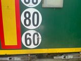 a close up of a train door with numbers on it