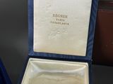 an image of a gold ring in a blue box with a diamond in it