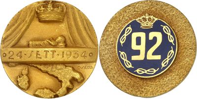 a close up of a gold medal with a crown on it
