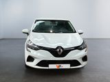 the front view of a white car parked in a showroom