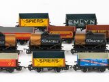 a lot of small toy trains on a white surface