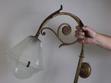 a person that is holding a lamp in their hand