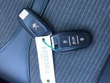 a car key that is attached to the back seat of a car