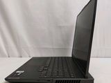 the laptop is sitting on a white surface with a white background
