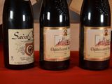 three bottles of wine sitting next to each other on a table