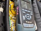 a bag that has a calculator and wires in it