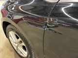 a close up of a car door handle with a sticker on it