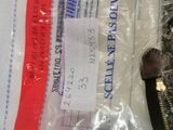 a zipper that has a tag on it in a bag