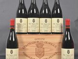six bottles of red wine in a wooden box