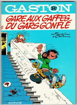 a book with a cartoon character riding a skateboard down a flight of stairs